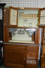 Antiquing cabinets is the process of applying a dark glaze to a lighter cabinet door, to give it the appearance of old age and wear and tear. Antique Canadiana Hoosier Kitchen Cabinet With Many Of The Original Fittings Including Sifter Pull