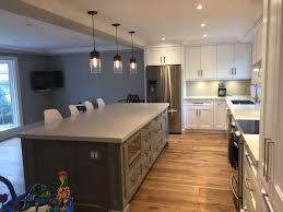 If you want the kitchen island to serve as a dining or sitting area as well, you can easily add chairs to the design. Grey Island With White Cabinets 10 Foot Island With Alpine Mist Caeserstone Quartz White Cabinets New Homes House