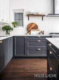 Modern kitchen with dark gray cabinents, vintage runner and marble countertops. These 15 Grey And White Kitchens Will Have You Swooning