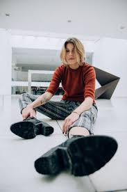 Apparel Clothing Human Woman Sitting On Woman Sitting On Floor Tiles Inside Building Fashion Inexpensive Fashion Sitting Poses Fashion Model Pictures