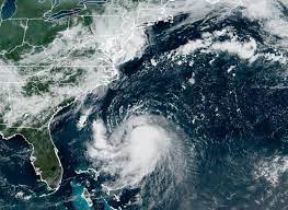 The orange circle indicates the current position of the center of the tropical cyclone. 2x060syc9czs M