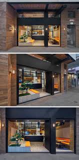 The Facade Of This Modern Coffee Shop Is Open To The Street And Defined By A Dual Black Door Frame Surrounde Restaurant Facade Modern Coffee Shop Retail Facade