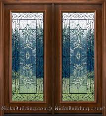 Our doors are available in a wide range of raised panel, flat panel, glass or combinations of both, all with matching bifolds to satisfy your own unique tastes. Mahogany Patio Doors With Beveled Glass And Wrought Iron Detailing