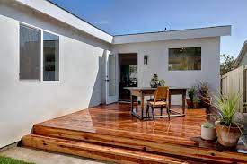 Adding a deck to a house. How Much Does It Cost To Build A Deck Diy