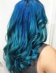This super colorful style was created to be reminiscent of a mermaid, with saturated blue on the top half of the hair, transitioning into a bright aqua turquoise on the bottom section. 20 Beautiful Styling Ideas For Blue Ombre Hair