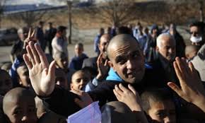 Hundreds of Iranian students shave their heads after teacher diagnosed with  cancer