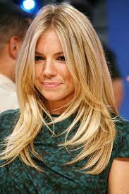 These bangs frame your face on both sides. Picture Of A Long Cascading Haircut With Layers And Face Framing Bangs For A Cute Look