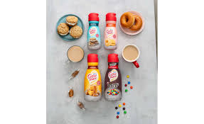 25% cyan blue, 25% orange, 12.5% green, 12.5% bright yellow, 12.5% red, 12.5% brown m&m's milk and dark chocolate clv: Coffee Mate Debuts New Creamers For 2021 Including Co Branded M Ms Flavor 2021 01 14 Refrigerated Frozen Foods
