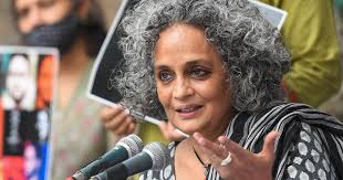 Plea in HC against Arundhati Roy book for cover showing her smoking without  mandatory health warning