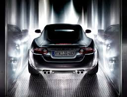 Black vehicle, black car, sports car, bokeh, tail light, downtown. Jaguar Xrk Uwe Breitkopf Photography
