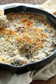 Onion And Garlic Getting Sauteed Vegan Spinach Artichoke Dip Artichoke Dip Recipe Spinach Artichoke Dip