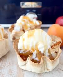 Crock pots are for more than just dinner. This Scrumptious Crock Pot Dessert Is Made By Filling Easy Homemade Taco Cups With Slow Cooked Summer Fr Crock Pot Desserts Fruit Desserts Fruit Desserts Easy