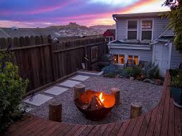Put a fence up with raised beds? Multiple Levels Give This Small Yard Room For Entertaining