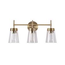 4.9 out of 5 stars. Manor Brook Bea 3 Light Antique Brass Vanity Light With Clear Glass Mb99073 The Home Depot Brass Vanity Light Brass Bathroom Lighting Vanity Lighting