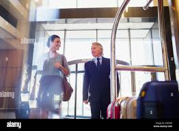 Man woman entering hotel hi-res stock photography and images - Alamy