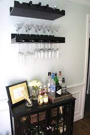 Put your finest bottles on display and if you're a true cocktail aficionado, you may want more than just a small cart to serve up drinks. An Organized Home Bar Area Paperblog Home Bar Areas Home Bar Decor Home Bar Designs