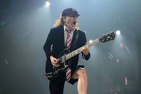 Does angus young drink alcohol?: Unearthed Interview How Angus Adopted Ac Dc Schoolboy Image