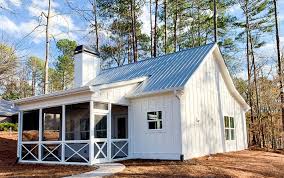 Coming in from the front porch you are greeted by a large open living space with views into the kitchen, dining , and rear porch. Cottage Style House Plans Custom English Cottage Home Designs