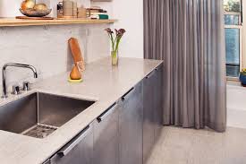 a modern limestone kitchen with long