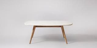 Metal coffee table legs are sturdy and offer a lot of support for your belongings. White Marble Coffee Table In Wood Legs