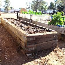 The previous owner had many garden beds, and the one he used for vegetables had old timbers surrounding it that looked questionable. Pin By Lea Estes On Raised Garden In 2021 Building Raised Garden Beds Building A Raised Garden Sloped Garden