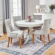 Enhance your space with a velvet armchair. Wilmslow White Round Dining Table With 4 Light Grey Velvet Chairs The Furniture Market