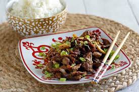 A close up of mongolian beef with green onions. Easy Mongolian Beef Recipe Copykat Recipes