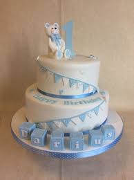 From so many cake choices that you can consider to have to present, you can consider. 2 Tier Baby Blue White 1st Birthday Cake With Blocks Bunting And Bear Baby Birthday Cakes Baby Boy Birthday Cake Birthday Cake Tutorial