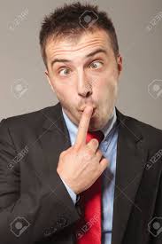 Business Man Making A Hilarious Face While Holding One Finger To His Mouth.  Stock Photo, Picture and Royalty Free Image. Image 37322657.