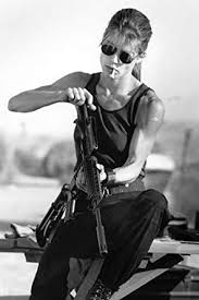 At the end of terminator 2: Linda Hamilton In Terminator 2 Judgment Day Iconic Sarah Connor With Cigarette Loading Gun 11x17 Mini Poster At Amazon S Entertainment Collectibles Store