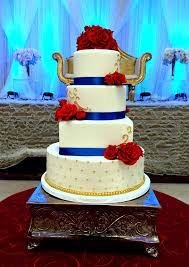 Royal Blue Red And Gold Cake Top Three Tiers Covered In Cake Couture Fondant Available On Our Royal Blue Wedding Cakes Wedding Cakes Blue Gold Wedding Cake