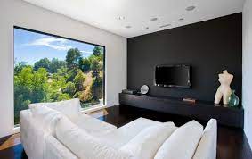 This living room looks luxury and opulence thanks to the choice of black material for the complete wall behind the tv. See What You Can Do With A Black Feature Wall