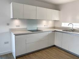 White kitchen with grey worktops. Modern White Gloss J Handle Kitchen Appliances Worktops Used Kitchen Hub