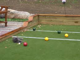What makes a bocce ball court are the markers dividing the court into different sections. How To Play Bocce Ball On A Court Arxiusarquitectura