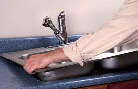 Set the new sink in the countertop hole to verify that it fits. How To Install A Kitchen Sink Hometips