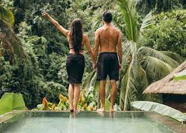 Couple At Poolside Best Honeymoon Destinations Honeymoon Destinations Best Honeymoon