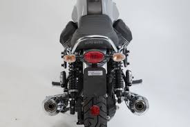 The kit comprises of seat handles, manifolds and exhaust system, passenger foot pegs, leather tank belt, tank rack, aluminum side number panel, cross handlebars, handlebar bumper. Sysbag 10 10 Bag System For V7 Iii Carbon Milano Rough Sw Motech