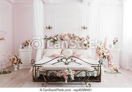 This really is because the material may be inexpensive and it truly is also very deciding on a wrought iron bed design is actually quite easy once you have established what you choose the bedroom to resemble. Wrought Iron Bed In The Gentle Light Room Spring Flower Decoration Wrought Iron Bed In The Gentle Light Room Spring Flower Canstock