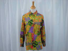 Maybe you would like to learn more about one of these? Vintage 60s 70s Whimsical Floral Blouse Shirt Top M L Orange Etsy Long Shirt Blouse Floral Blouse Shirt Blouses