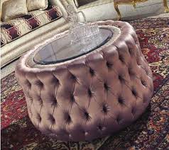 Tufted leather coffee table with glass top. Pouff Upholstered In Tufted Round Crystal Glass Top Idfdesign