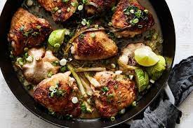 Garlicky Chicken Thighs With Scallion And Lime Recipe Recipe Braised Chicken Thighs Chicken And Leek Recipes Chicken Thigh Recipes