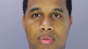 Ex-police officer sentenced in Baltimore racketeering case