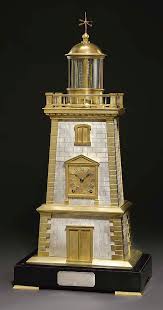 A very nice late 19th century gilt and silvered bronze animated lighthouse clock. Lighthouse A French Brass And Silvered Brass And Marmo Nero Belgio Eight Day Striking Novelty Clock