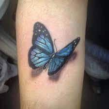 Most Common Tattoos 48 Blue Butterfly Tattoo Butterfly Tattoo Designs Butterfly Tattoo On Shoulder