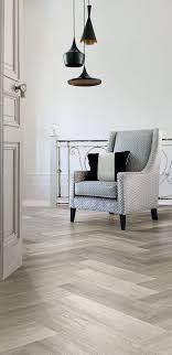 Light Parquet Wood Floor With Grey Chair And Tom Dixon Style Lighting House Flooring Luxury Vinyl Flooring Living Room Flooring