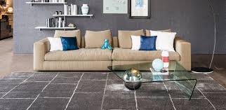 The coffee table features a rectangular or shaped curved clear glass top. Globe Coffee Tables Cattelan Italia