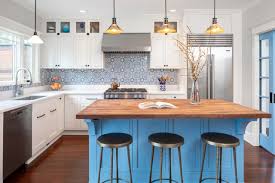 The elegant morel stain blends and harmonizes the natural hickory wood grain while emphasizing the grain with a subtle gray tone that beautifully coordinated with the cool, deep blue paint. 6 Beautiful Blue And Wood Kitchens