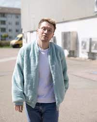 British Menswear Blogger James Samuel Wears Pastel Blue Faux Fur Bomber Jacket From Boohoo Man With 90 Blue Jackets Outfits Leather Jacket Men Denim Jacket Men