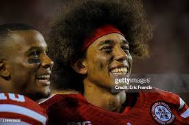 Quarterback Allan Bridgford of the Southern Miss Golden Eagles hands...  News Photo