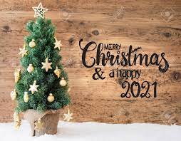 Christmas Tree, Wooden Background, Snow, Merry Christmas And A Happy 2021  Stock Photo, Picture and Royalty Free Image. Image 154210721.
